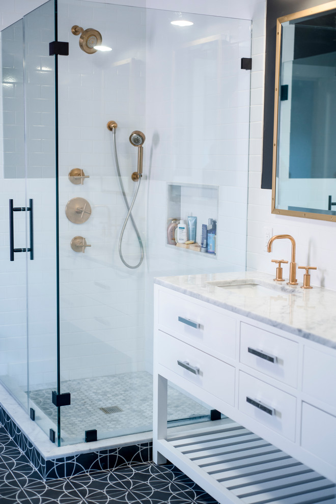 Inspiration for a large scandinavian master white tile and subway tile ceramic tile corner shower remodel in New York with flat-panel cabinets, white cabinets, white walls, an undermount sink and marble countertops