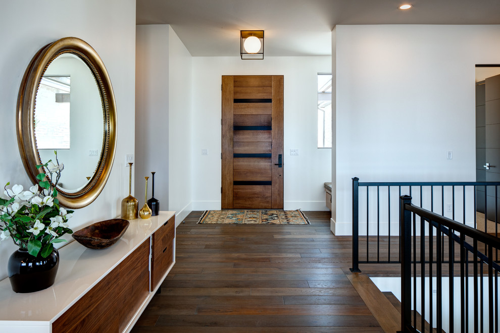 Communities - Herriman, UT (37) - Example of a mid-sized country dark wood floor and brown floor front door design in Salt Lake City with white walls and a medium wood front door