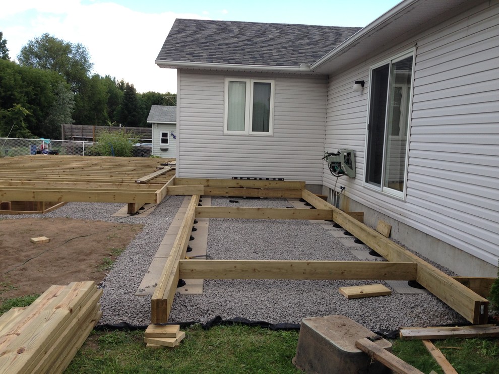Example of a huge transitional backyard deck design