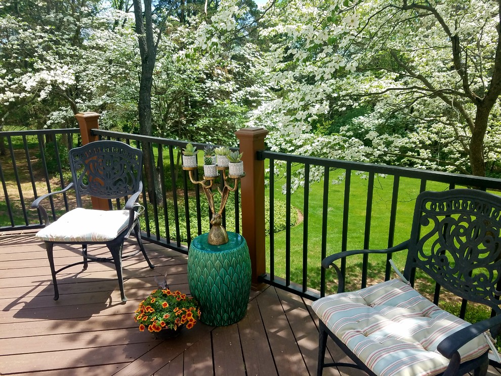 Design ideas for an expansive traditional backyard deck in Other with no cover.