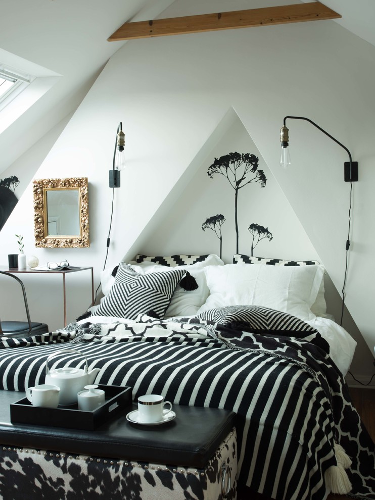 This is an example of a mid-sized eclectic bedroom in London with white walls.