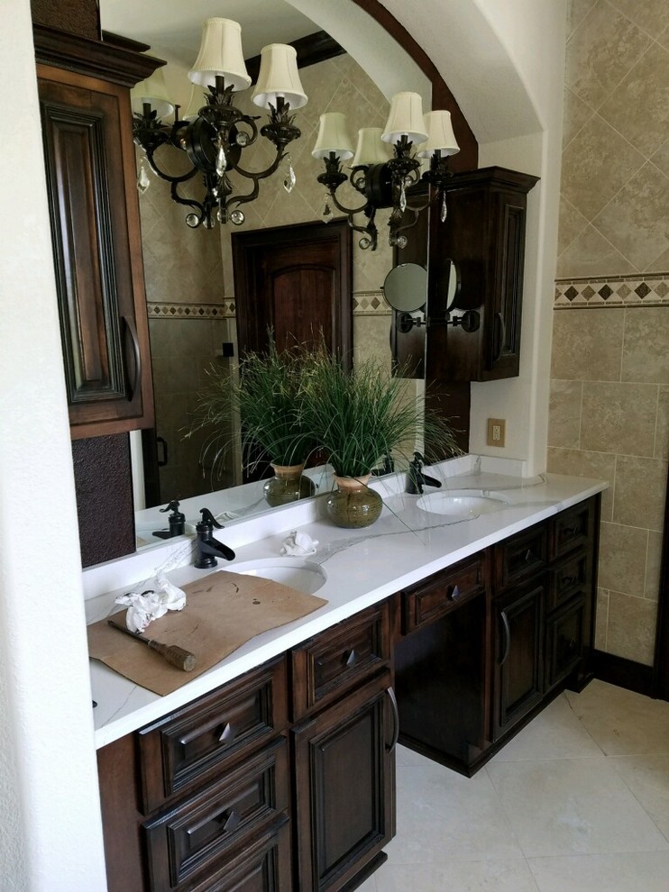Large traditional master bathroom in Phoenix with beaded inset cabinets, brown cabinets, brown tile, a drop-in sink, marble benchtops and white benchtops.
