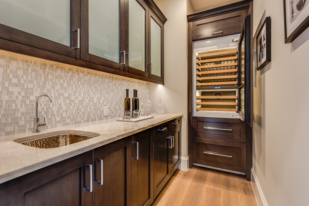 This is an example of a mid-sized beach style wine cellar in Other with medium hardwood floors.