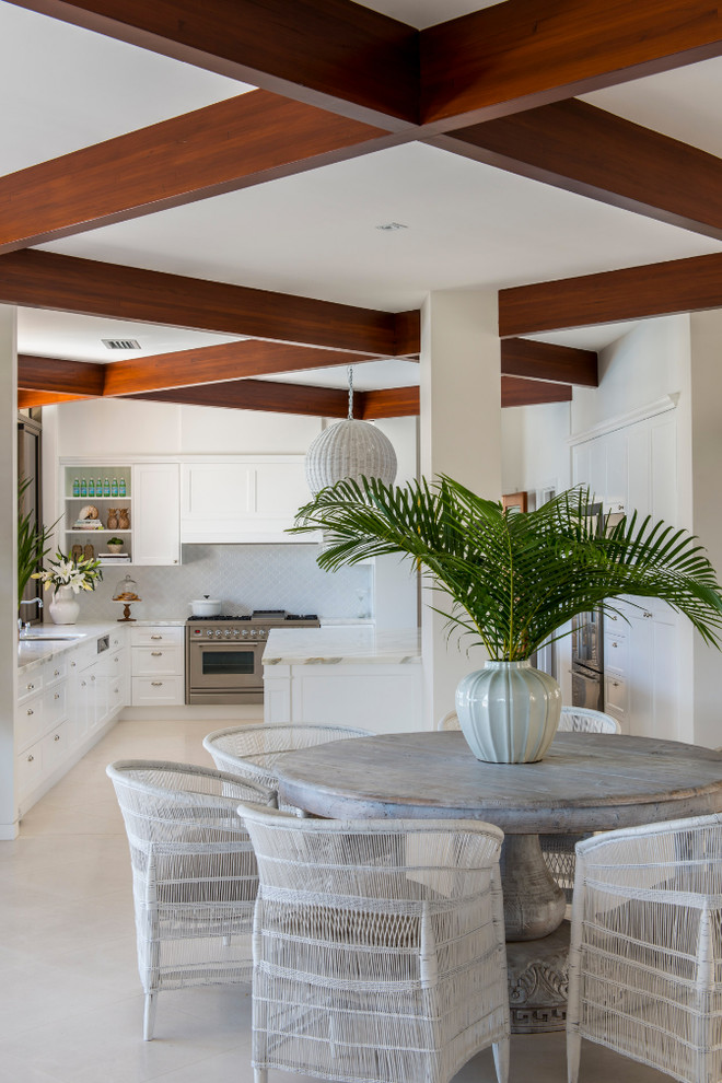 Photo of a beach style kitchen/dining combo in Brisbane.