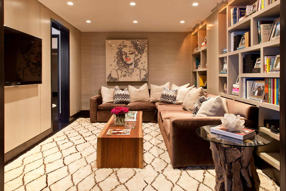 Contemporary enclosed family room in New York with brown walls, carpet and a wall-mounted tv.