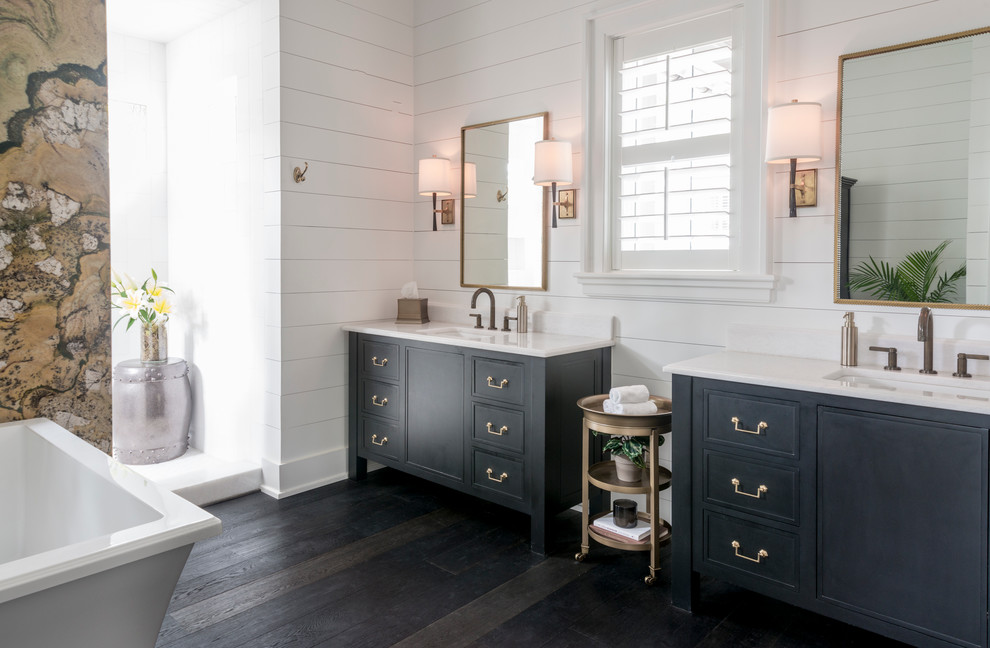 Large country master bathroom in Charleston with black cabinets, a freestanding tub, an open shower, white walls, dark hardwood floors, an undermount sink, recessed-panel cabinets and an open shower.