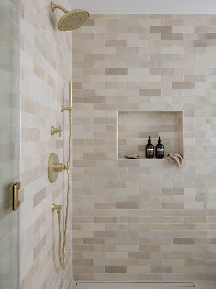 Large transitional master beige tile and ceramic tile porcelain tile, beige floor and double-sink freestanding bathtub photo in Seattle with shaker cabinets, brown cabinets, a one-piece toilet, white walls, an undermount sink, quartz countertops, a hinged shower door, white countertops and a built-in vanity