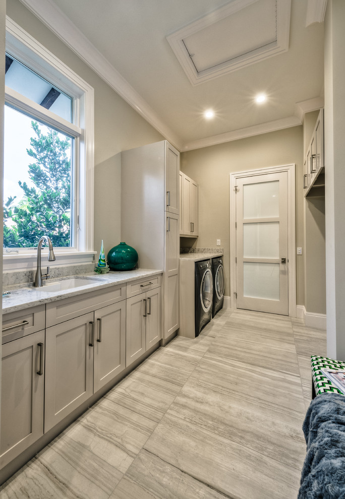 Example of a transitional home design design in Miami