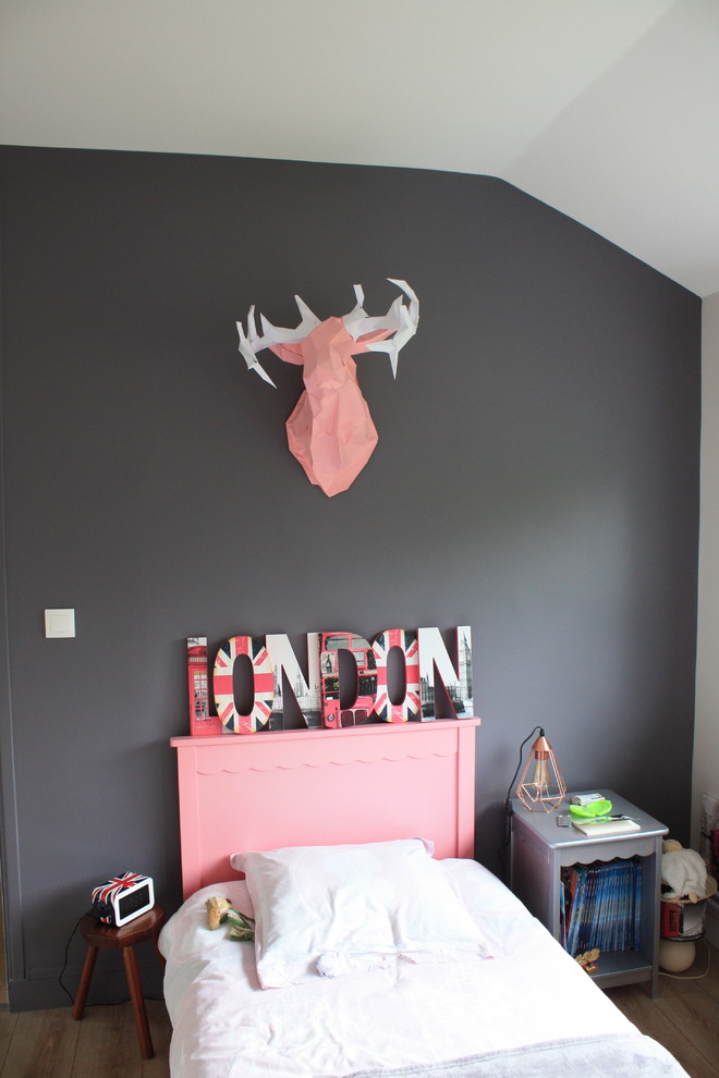 Inspiration for a mid-sized modern kids' room for girls in Other with purple walls and laminate floors.