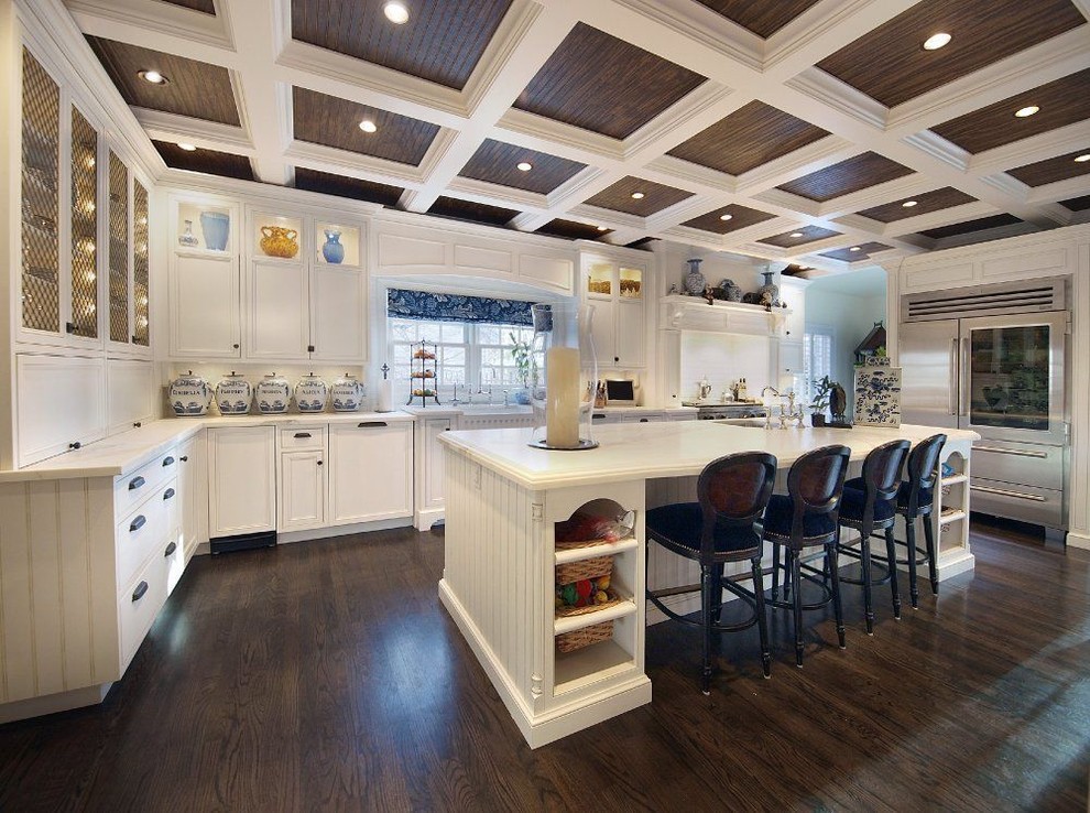 Inspiration for a traditional kitchen in Denver with stainless steel appliances and white cabinets.