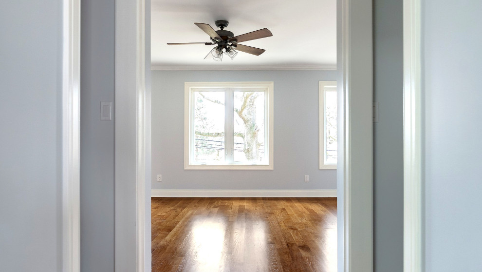 Bedroom with Ceiling Fan and Crown Molding