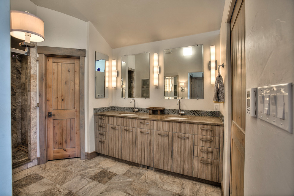 Inspiration for a rustic master ceramic tile ceramic tile double shower remodel in Denver with flat-panel cabinets, gray cabinets, a one-piece toilet, gray walls, an undermount sink and quartz countertops