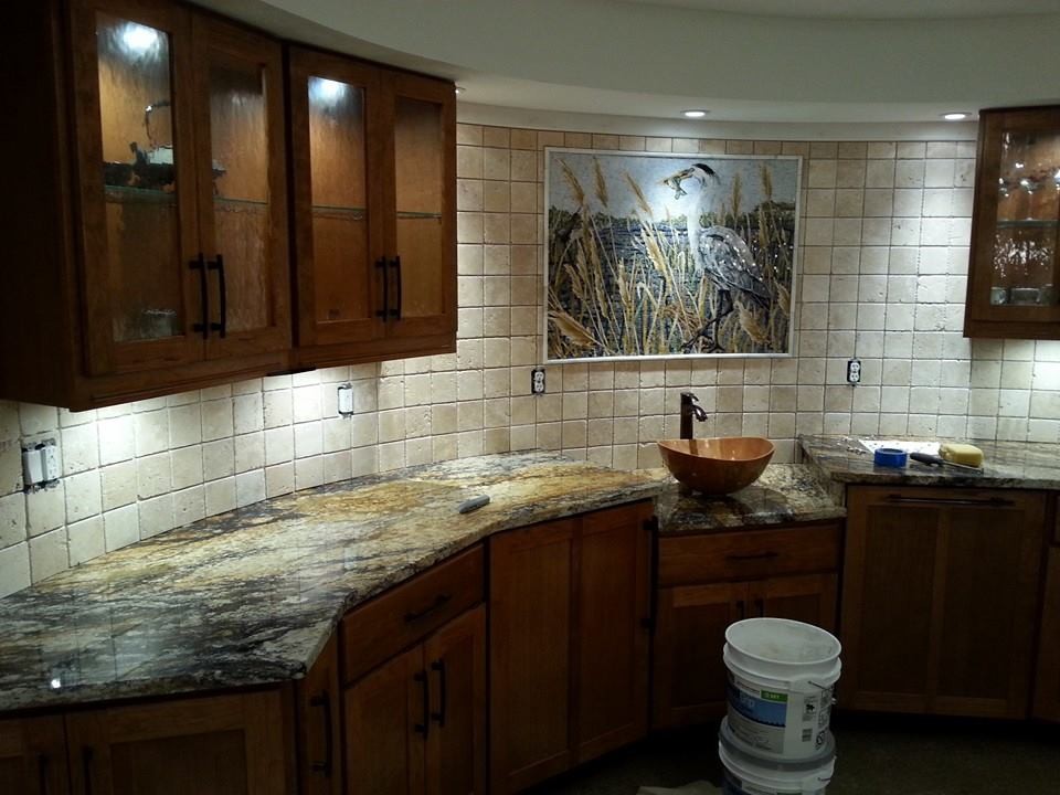 Example of a l-shaped eat-in kitchen design in Baltimore