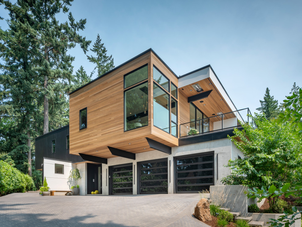 Idées déco pour une très grande façade de maison contemporaine en bois à un étage avec un toit plat.