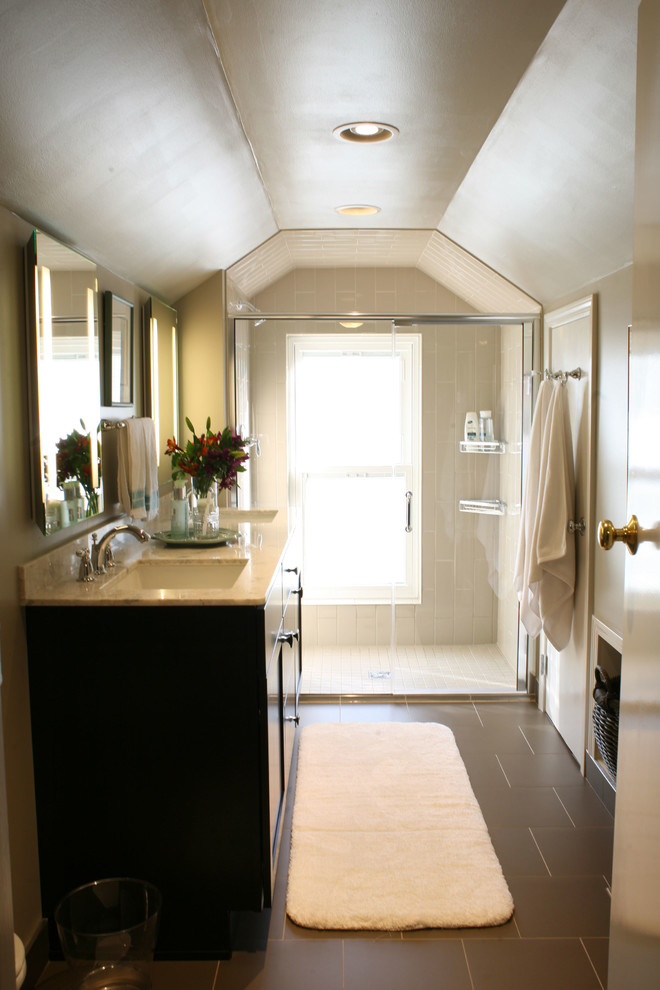 Inspiration for a small transitional 3/4 bathroom remodel with recessed-panel cabinets, brown cabinets and marble countertops