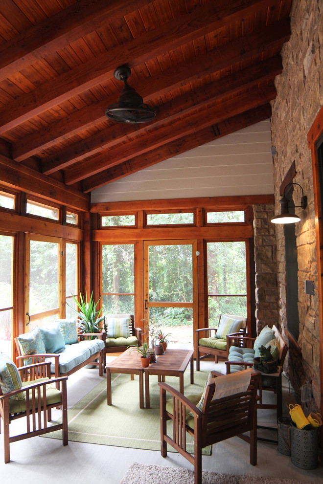 Photo of a mid-sized country sunroom in Houston with concrete floors and a standard ceiling.