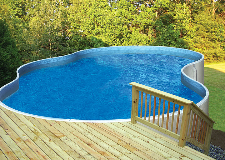 Large traditional backyard custom-shaped aboveground pool in Other with decking.