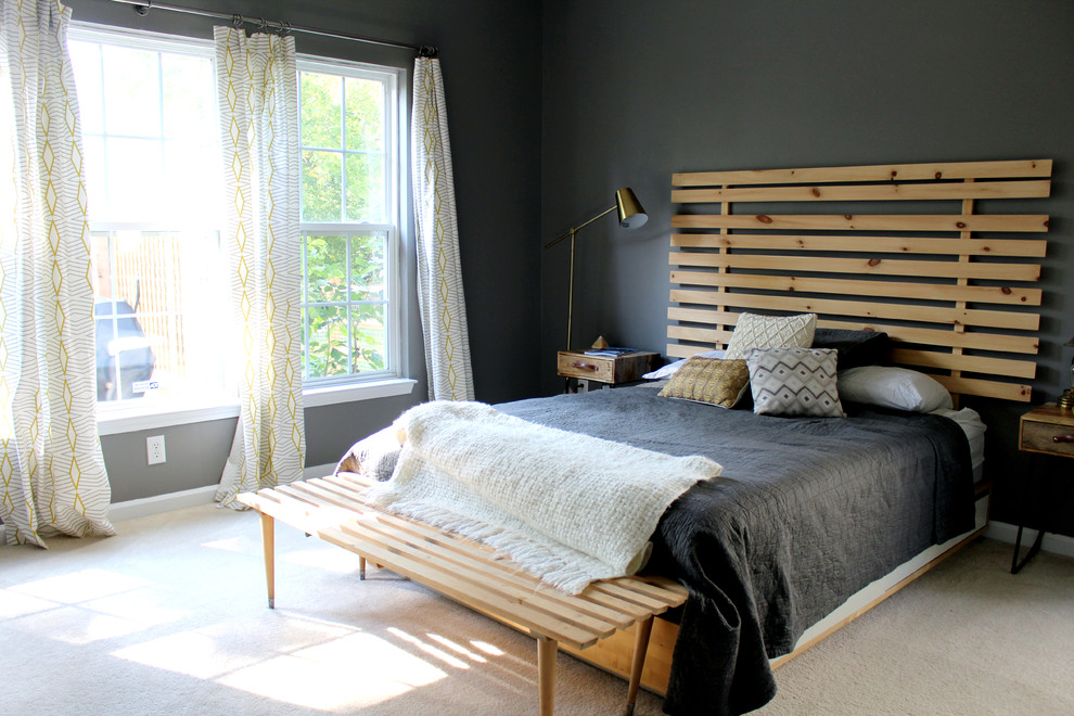Inspiration for a mid-sized contemporary master bedroom in Charlotte with grey walls and carpet.