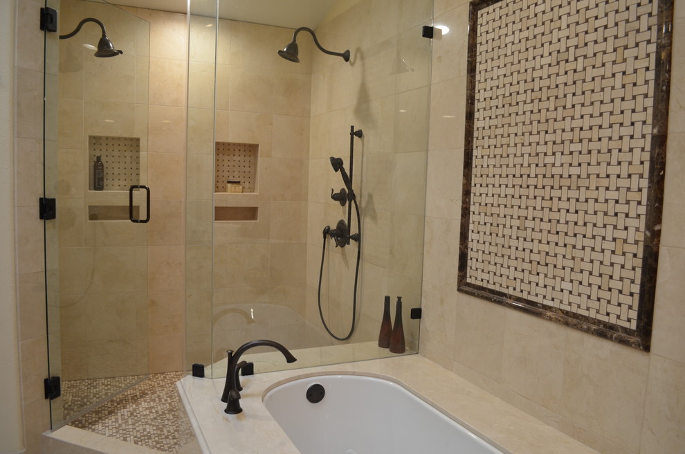 Large traditional master bathroom in Phoenix with an undermount sink, raised-panel cabinets, dark wood cabinets, marble benchtops, an undermount tub, a double shower, a bidet, beige tile, stone tile, orange walls and porcelain floors.