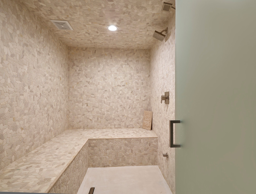 This is an example of a large modern wet room bathroom in Edmonton with beige tile, stone tile, with a sauna and a hinged shower door.