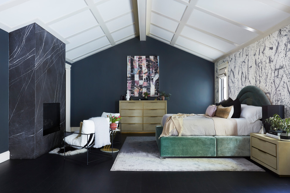This is an example of a large transitional master bedroom in Los Angeles with black walls, black floor and wallpaper.