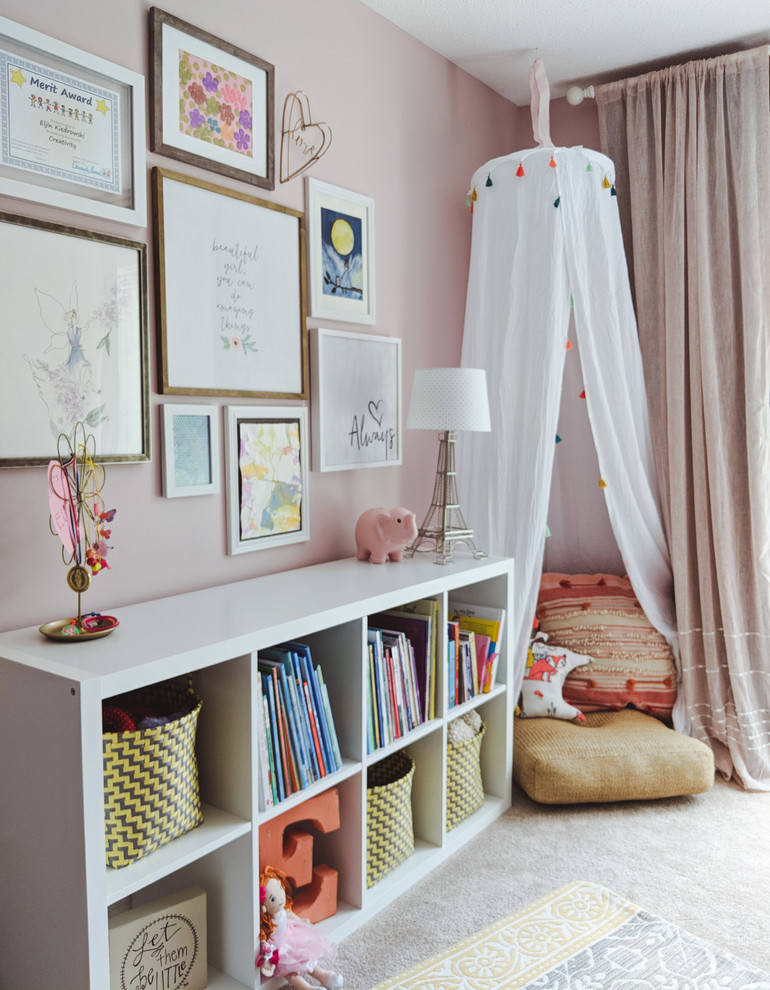 Design ideas for a mid-sized transitional kids' bedroom for kids 4-10 years old and girls in Other with pink walls, carpet and beige floor.
