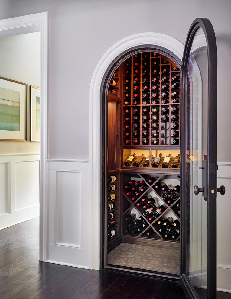 Small traditional wine cellar in Charlotte with storage racks.