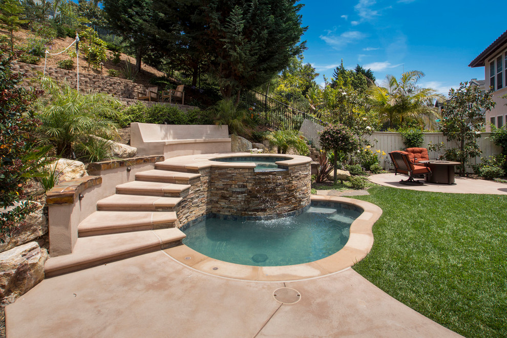 Design ideas for a traditional pool in San Diego with a hot tub.