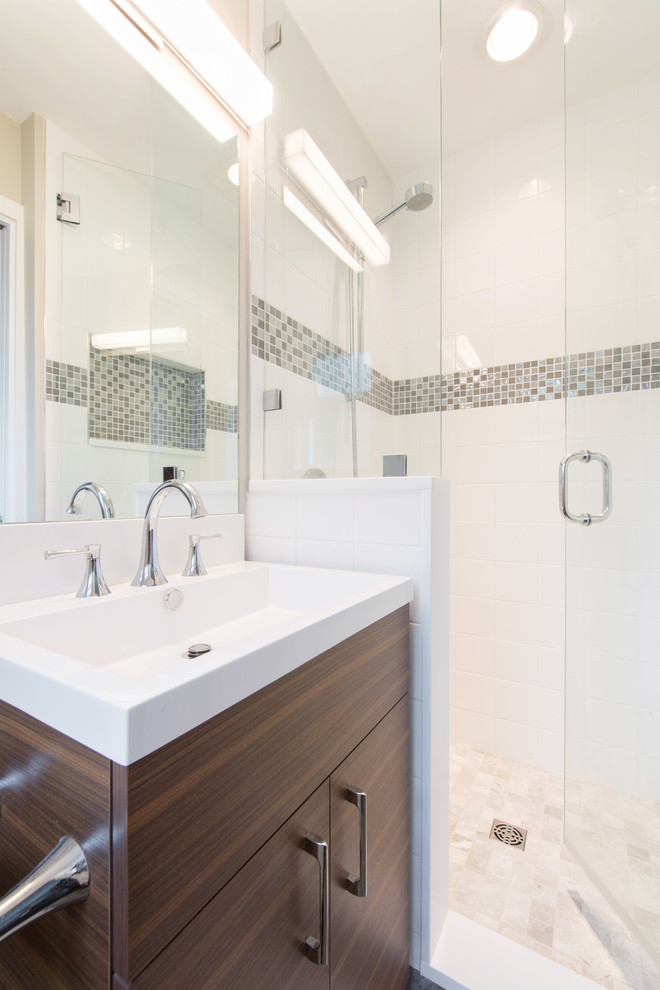 Inspiration for a small contemporary master bathroom in Vancouver with flat-panel cabinets, medium wood cabinets, a one-piece toilet, porcelain tile, porcelain floors and an integrated sink.