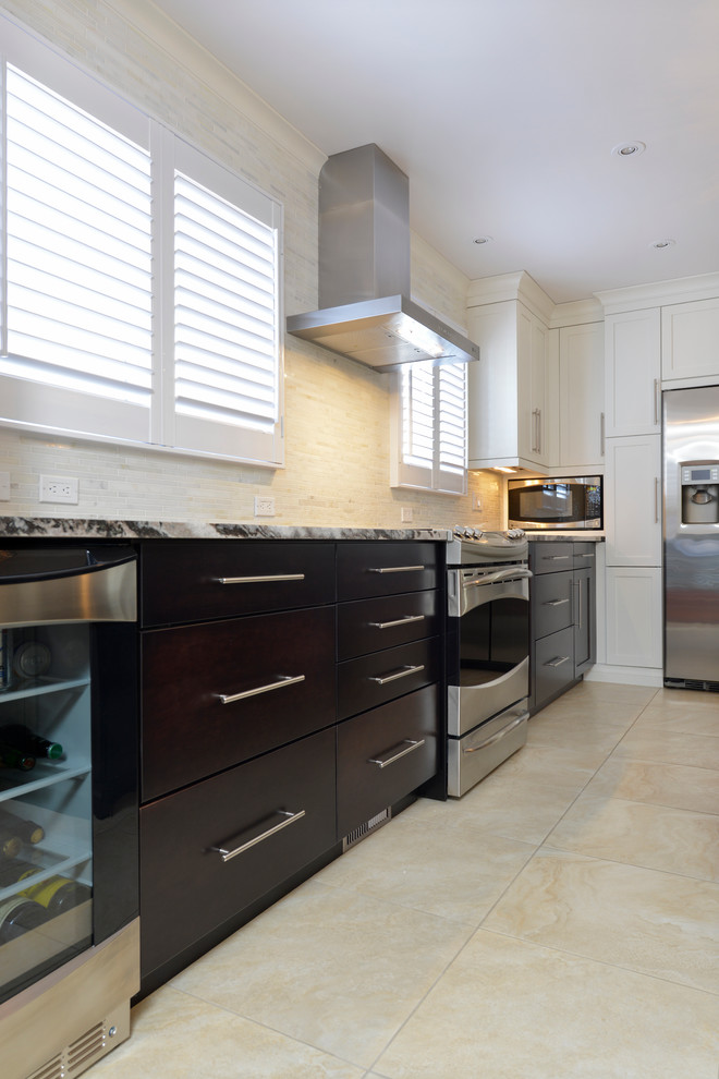 Inspiration for a large transitional u-shaped ceramic tile enclosed kitchen remodel in Toronto with an undermount sink, flat-panel cabinets, dark wood cabinets, granite countertops, beige backsplash, matchstick tile backsplash, stainless steel appliances and an island