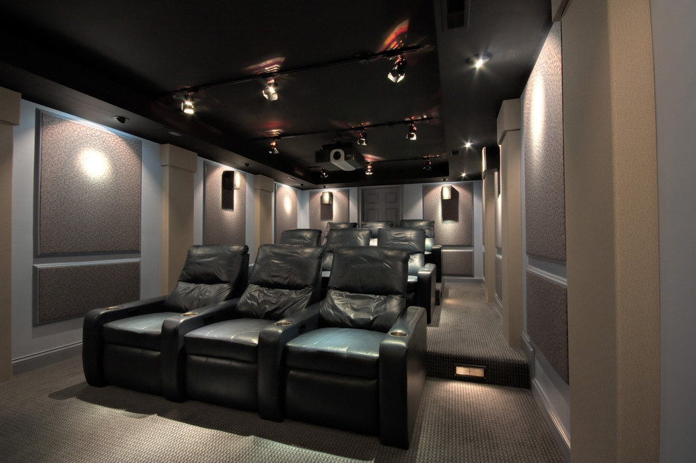 This is an example of a small modern enclosed home theatre in Chicago.