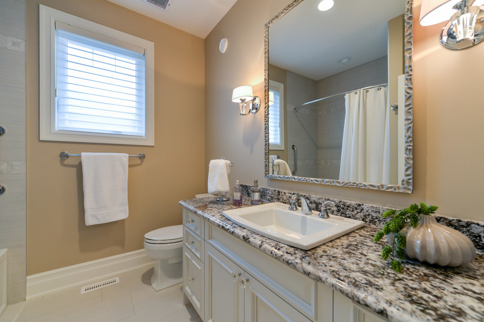 Example of a transitional home design design in Edmonton