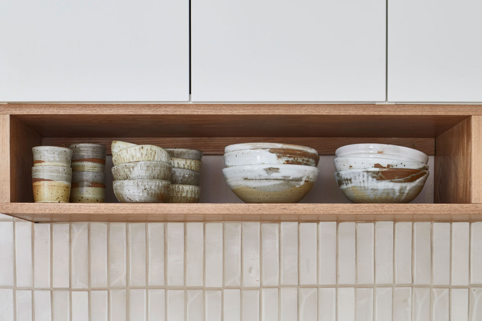 Scandi kitchen in Austin with marble worktops, ceramic splashback and an island.