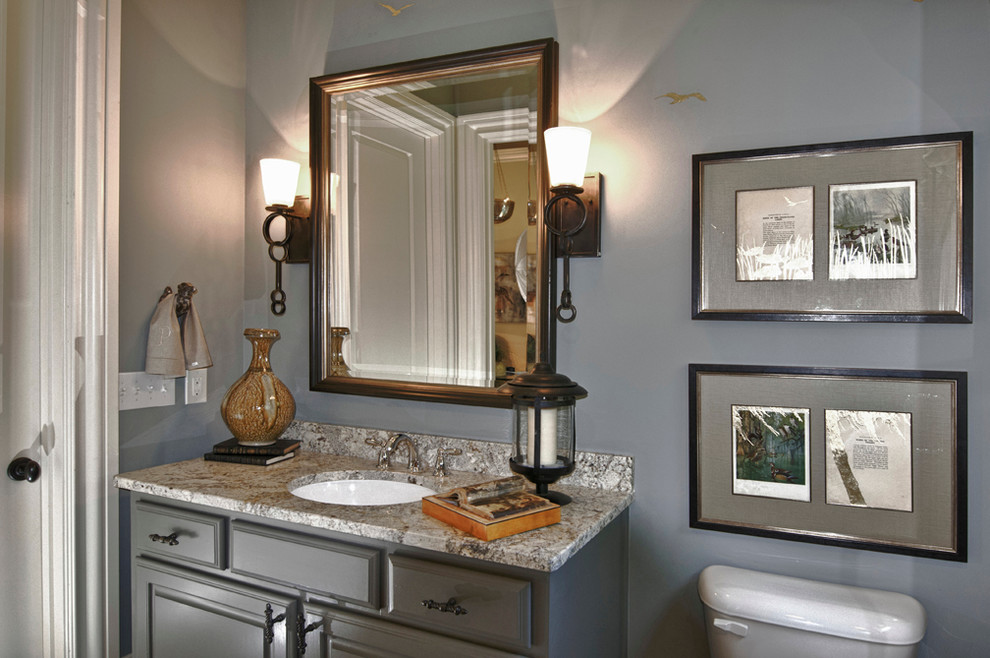This is an example of a traditional powder room in Atlanta.