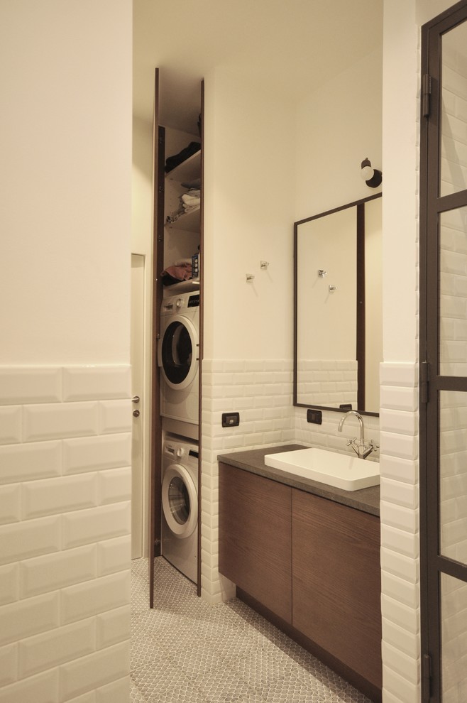Design ideas for a mid-sized industrial 3/4 bathroom in Milan with beaded inset cabinets, dark wood cabinets, an alcove shower, a two-piece toilet, white tile, subway tile, white walls, ceramic floors, a drop-in sink, granite benchtops, blue floor and a hinged shower door.