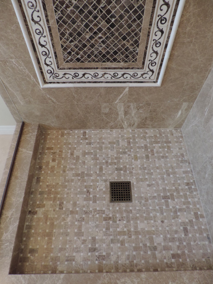 Inspiration for a mid-sized timeless 3/4 limestone floor corner shower remodel in Los Angeles with raised-panel cabinets, dark wood cabinets, a two-piece toilet, beige walls, an undermount sink and solid surface countertops