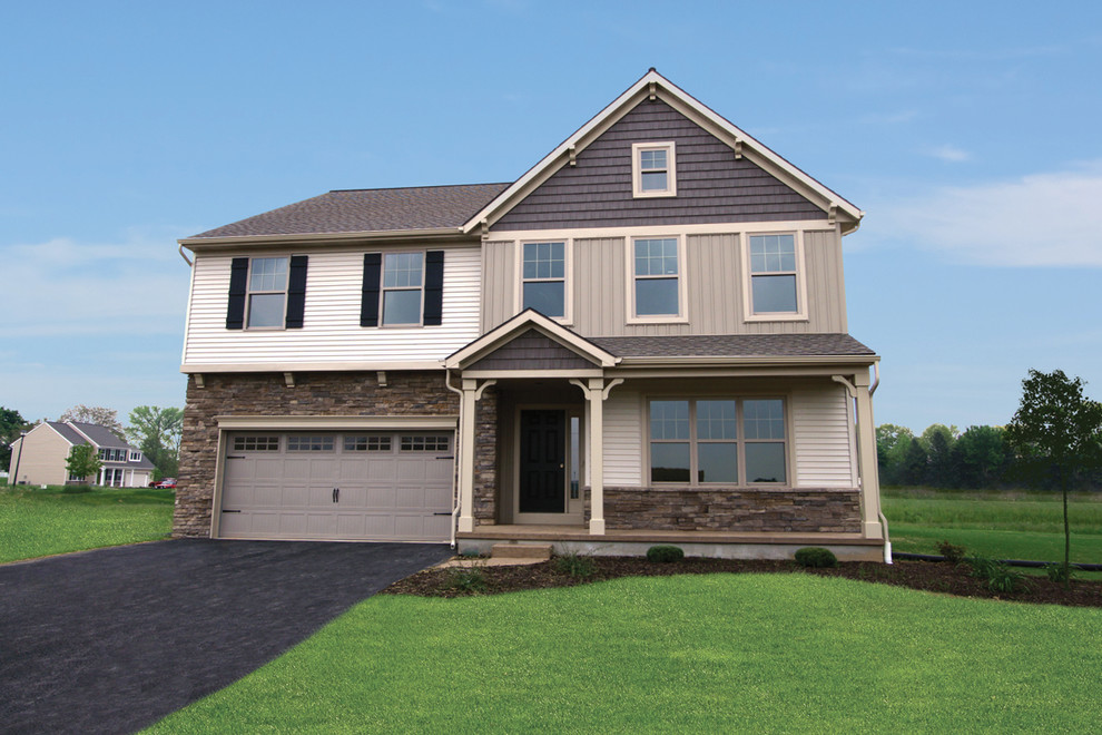Mid-sized elegant two-story beige home design photo