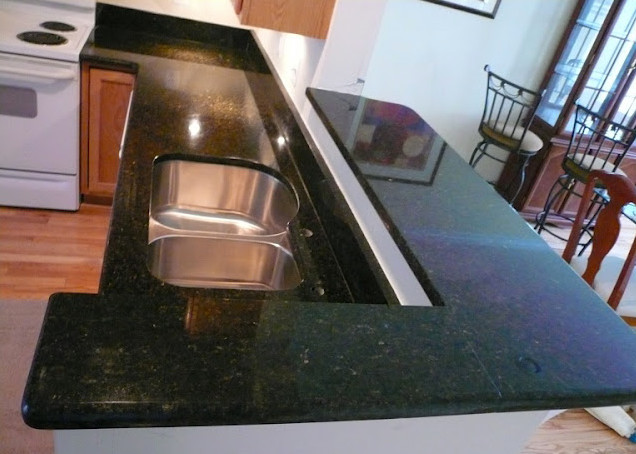 Transitional kitchen photo in DC Metro with beaded inset cabinets, light wood cabinets and an island