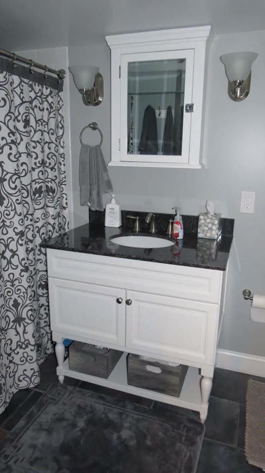 Mid-sized traditional master bathroom in Baltimore with raised-panel cabinets, white cabinets, an alcove tub, a shower/bathtub combo, a one-piece toilet, white tile, cement tile, grey walls, cement tiles, an undermount sink, granite benchtops and a shower curtain.