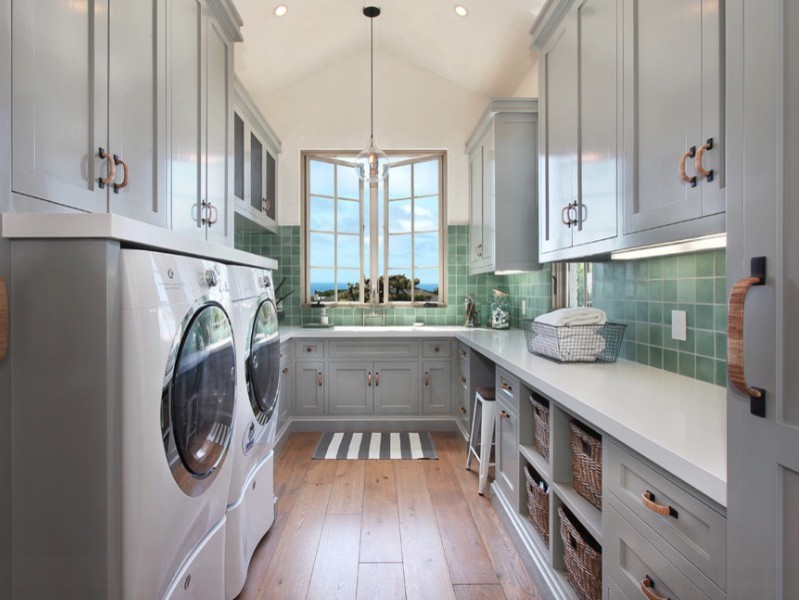 Large traditional u-shaped utility room in Other with a drop-in sink, shaker cabinets, grey cabinets, quartz benchtops, green walls, light hardwood floors, a side-by-side washer and dryer and beige floor.