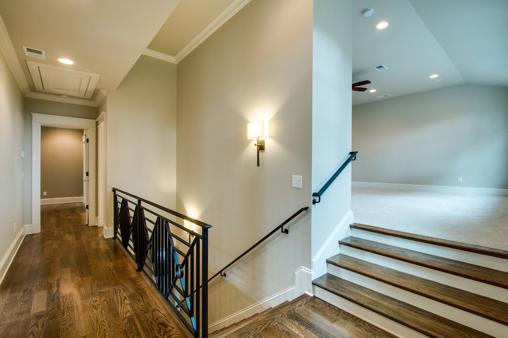 Photo of a mid-sized transitional hallway in Nashville with beige walls and medium hardwood floors.