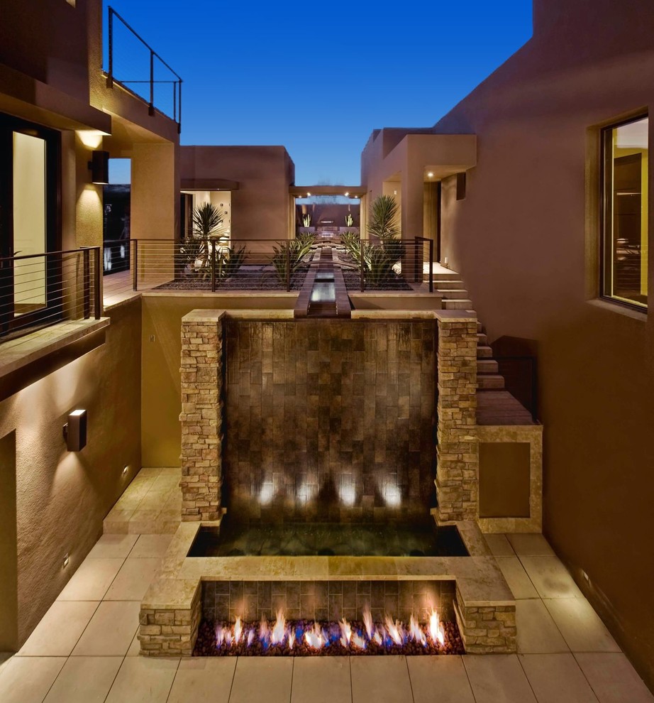 Design ideas for a contemporary patio in Las Vegas with a fire feature.