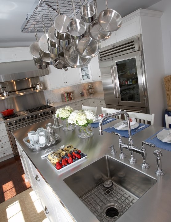 Inspiration for a large contemporary u-shaped dark wood floor eat-in kitchen remodel with shaker cabinets, white cabinets, stainless steel countertops, white backsplash, stainless steel appliances and an island