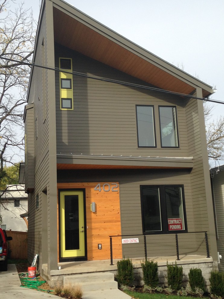 Large modern two-storey brown exterior in Nashville with concrete fiberboard siding.