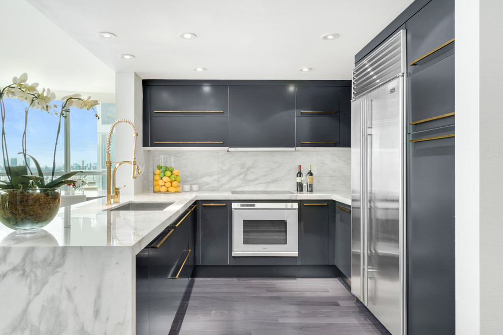 Mid-sized contemporary l-shaped separate kitchen in Miami with an undermount sink, flat-panel cabinets, grey cabinets, marble benchtops, marble splashback, painted wood floors, with island, grey floor, white splashback and stainless steel appliances.