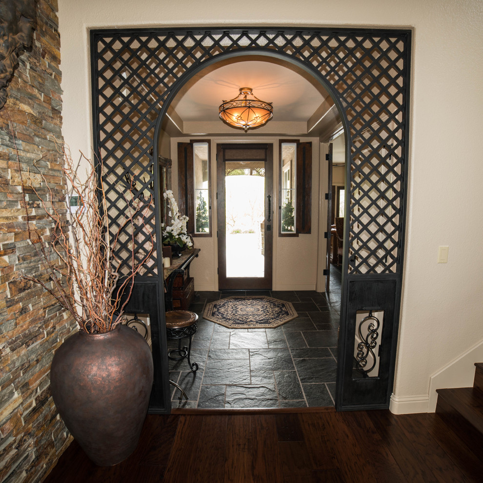 Mid-sized contemporary foyer in Sacramento with slate floors, a single front door and a brown front door.