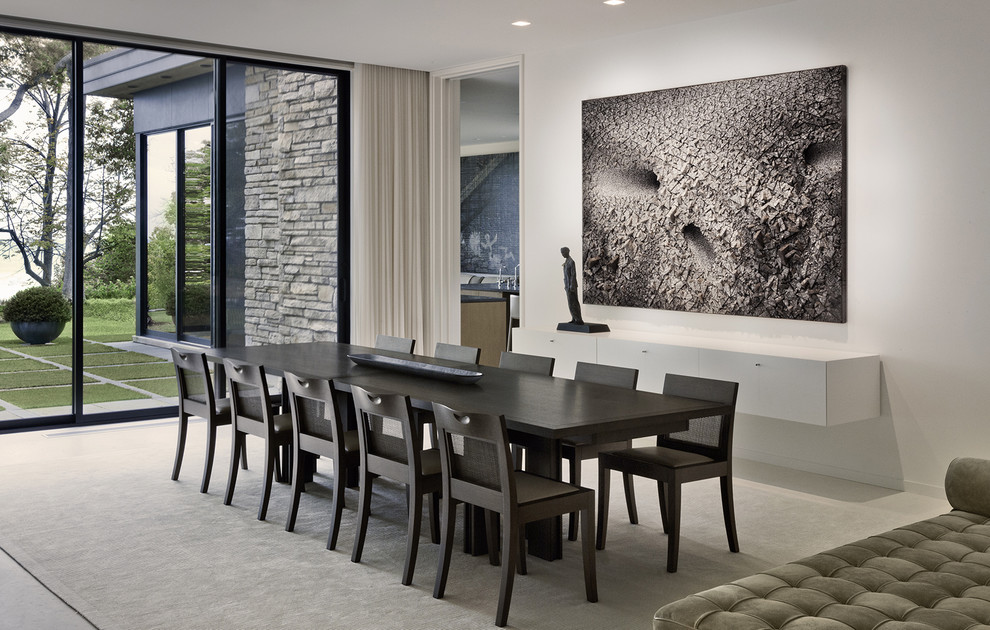 Photo of a contemporary dining room in Chicago with white walls.