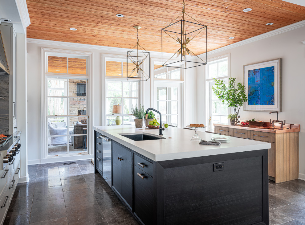 Inspiration for a large mediterranean kitchen remodel with recessed-panel cabinets, white cabinets, granite countertops, gray backsplash, marble backsplash and white countertops