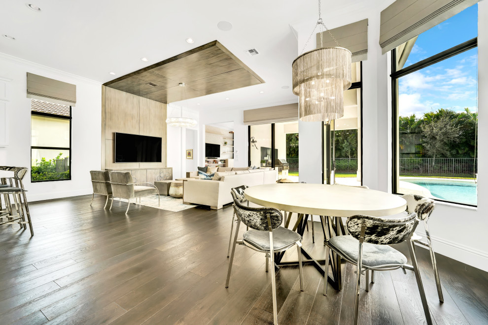 Inspiration for a large contemporary kitchen/dining combo in Miami with grey walls, dark hardwood floors and brown floor.