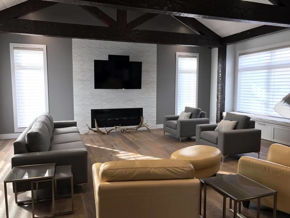 Example of a transitional home design design in Calgary